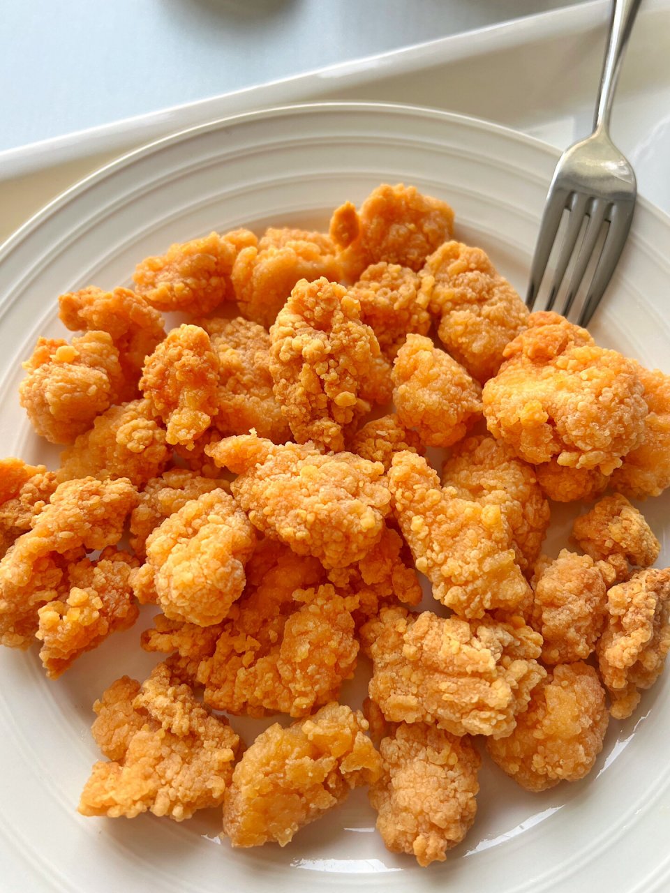 鸡米花图片  鸡米花是一种非常适合分享的食物,因为它小巧便于分食
