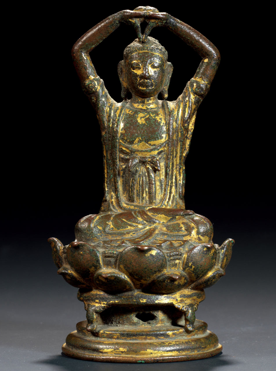 辽代铜鎏金佛像,高12.5厘米,重492克,嘉德拍卖会上以230万元成交.