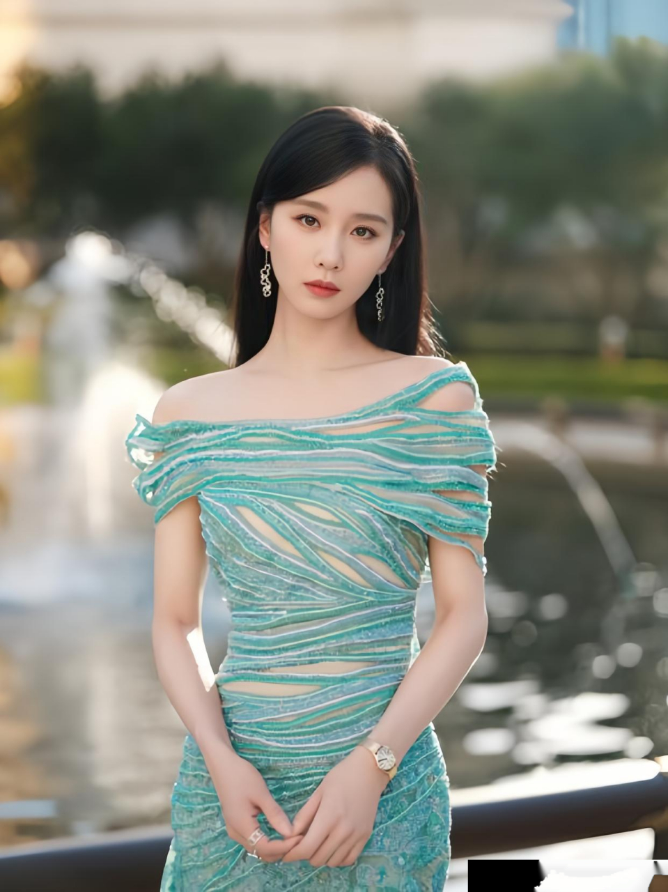 刘诗诗身着湖水绿一字肩礼服裙,宛如绿波荡漾的仙境仙子.