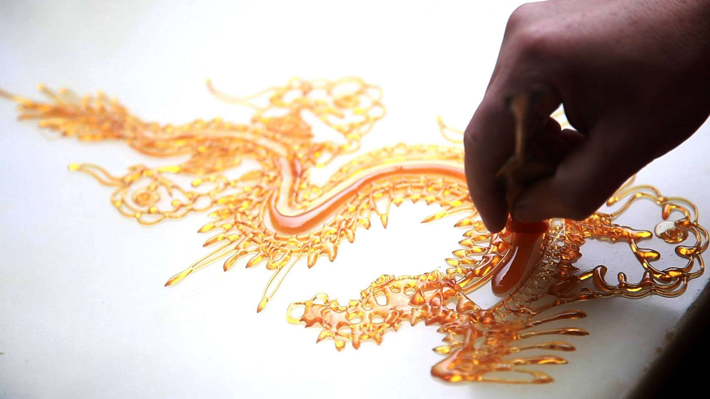 非遗文化 / 糖画,四川民间过去又称"倒糖饼儿""糖粑粑儿""糖灯影儿"等