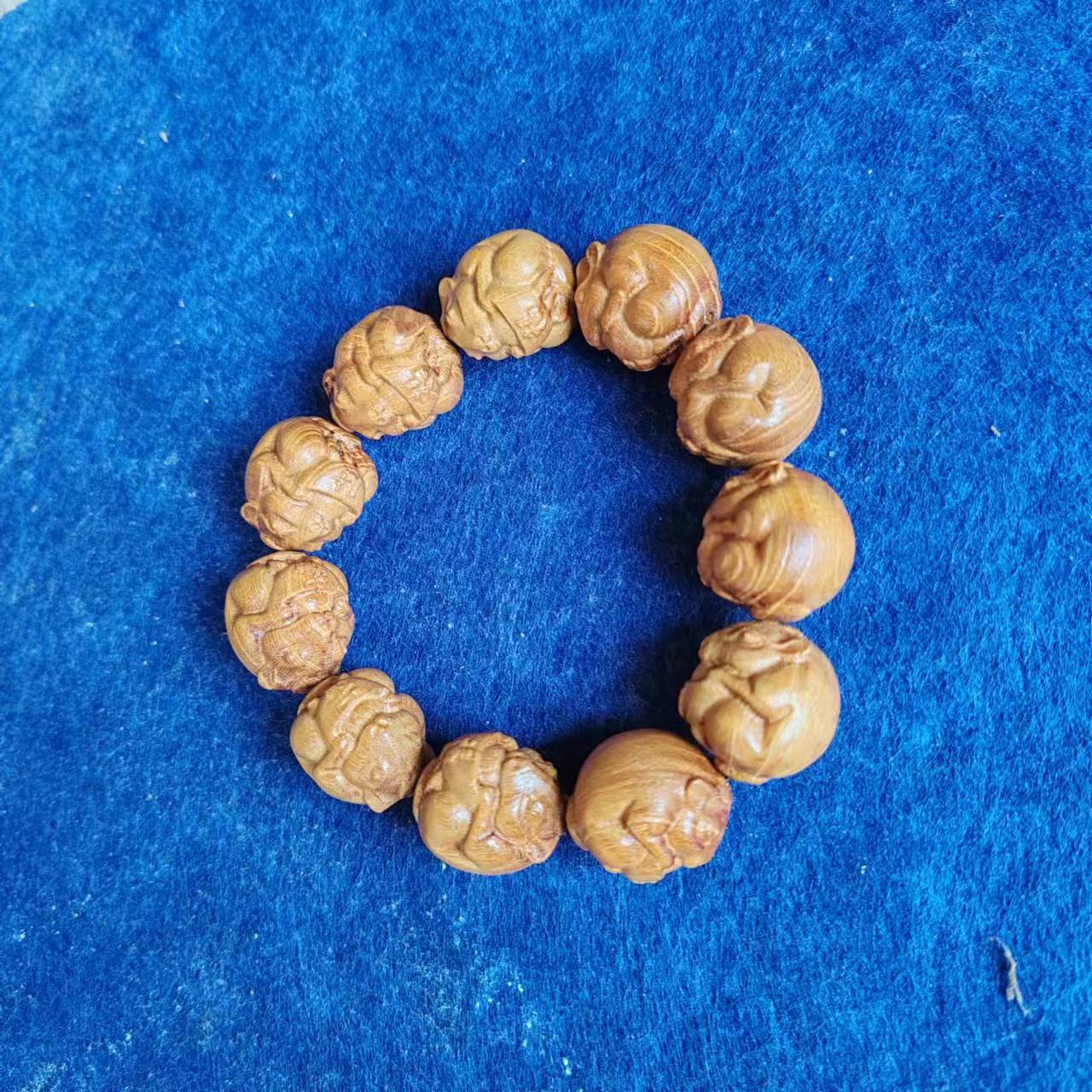 广西柘木木雕圆雕手串手把件