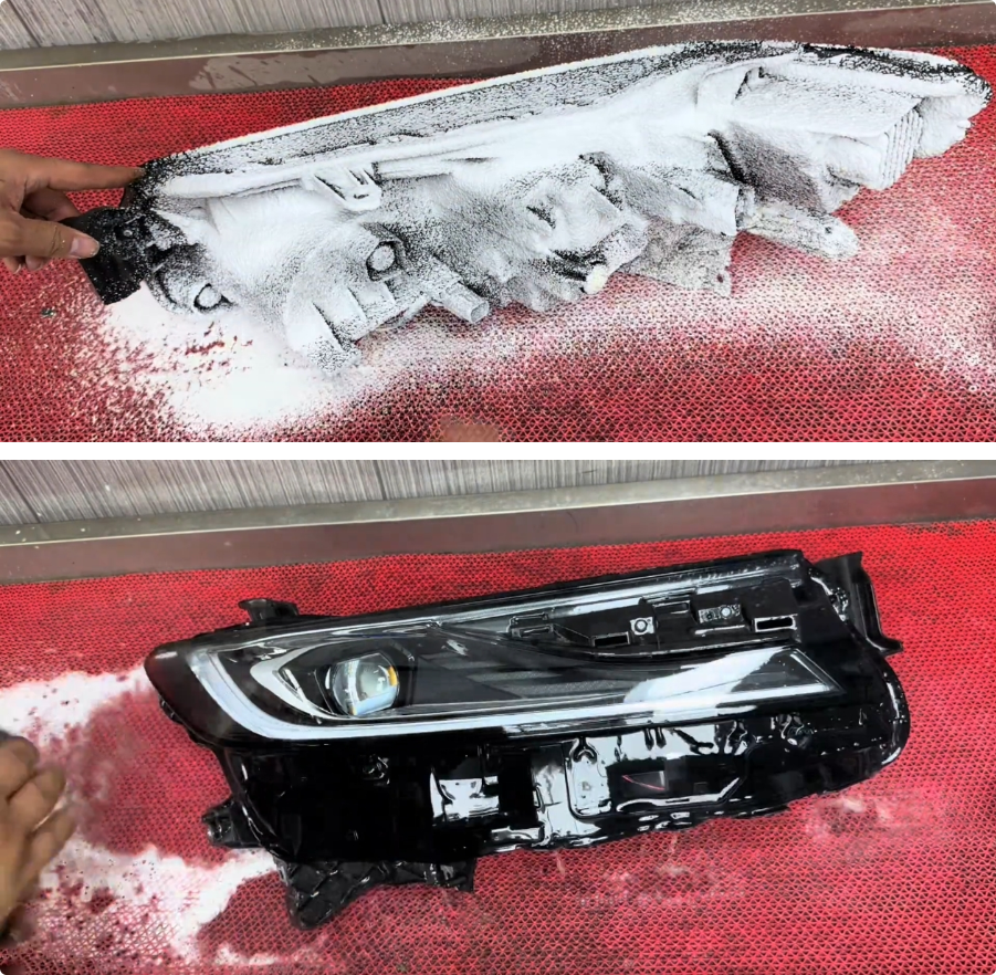 技师在无尘车间内用水平仪为车辆调试透镜灯光角度