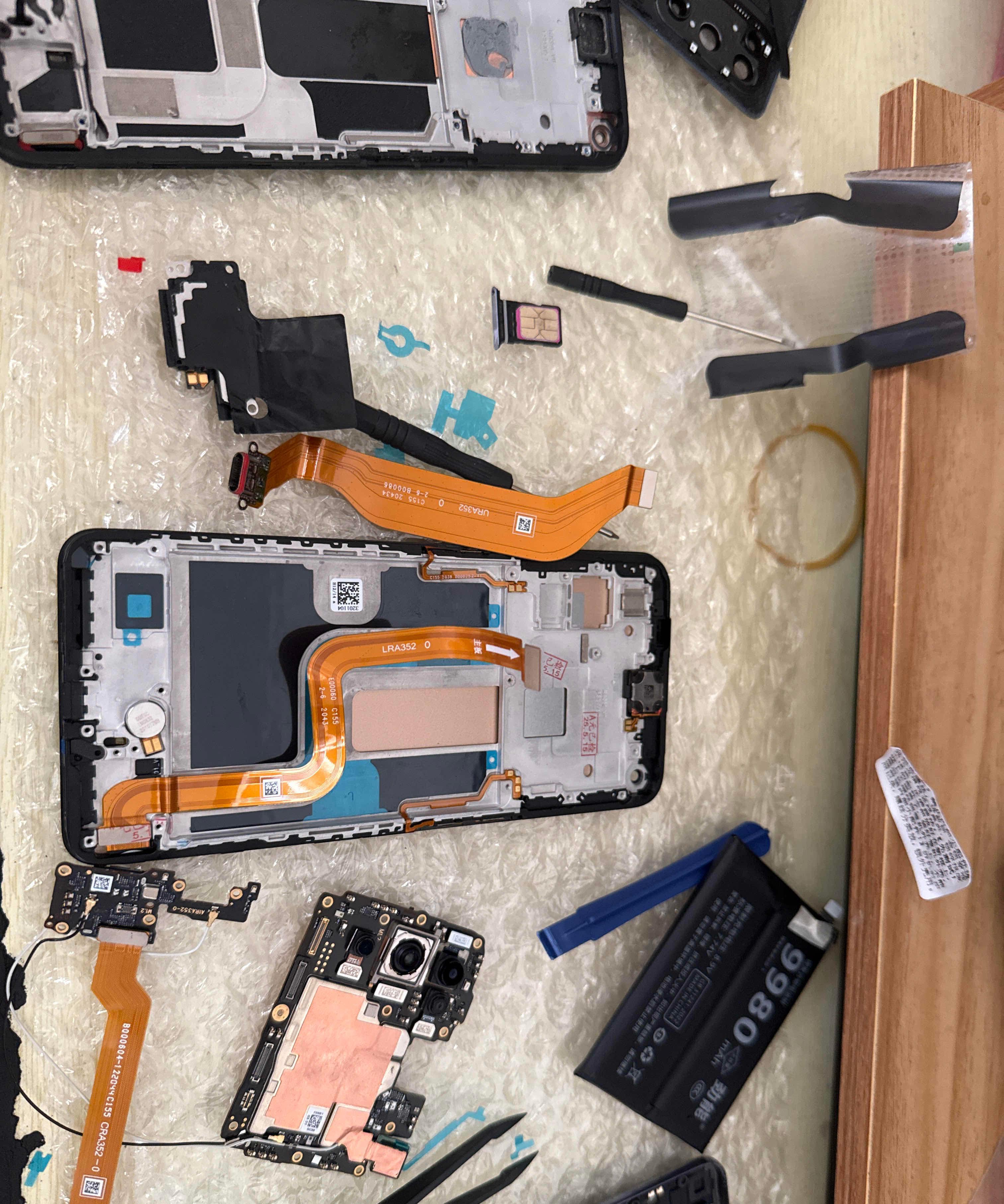 铁碳合金手机零件图片小米14维修图片真实手机配件分布图拆手机内部hi