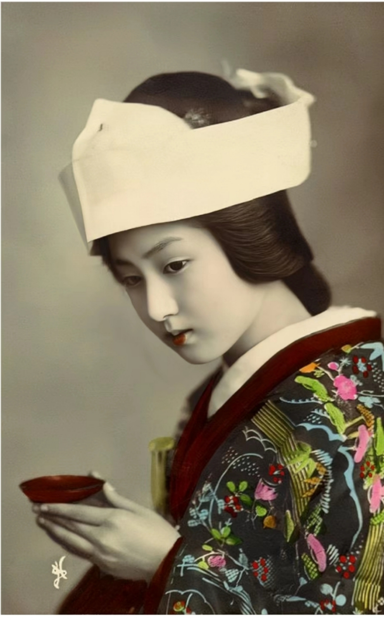 日本明治时期的艺伎,涂抹着口红,画着淡妆,头发上戴着白色毛子,穿着