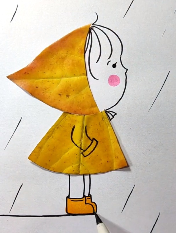 随手捡了几片叶子用树叶来拼贴雨中的小女孩