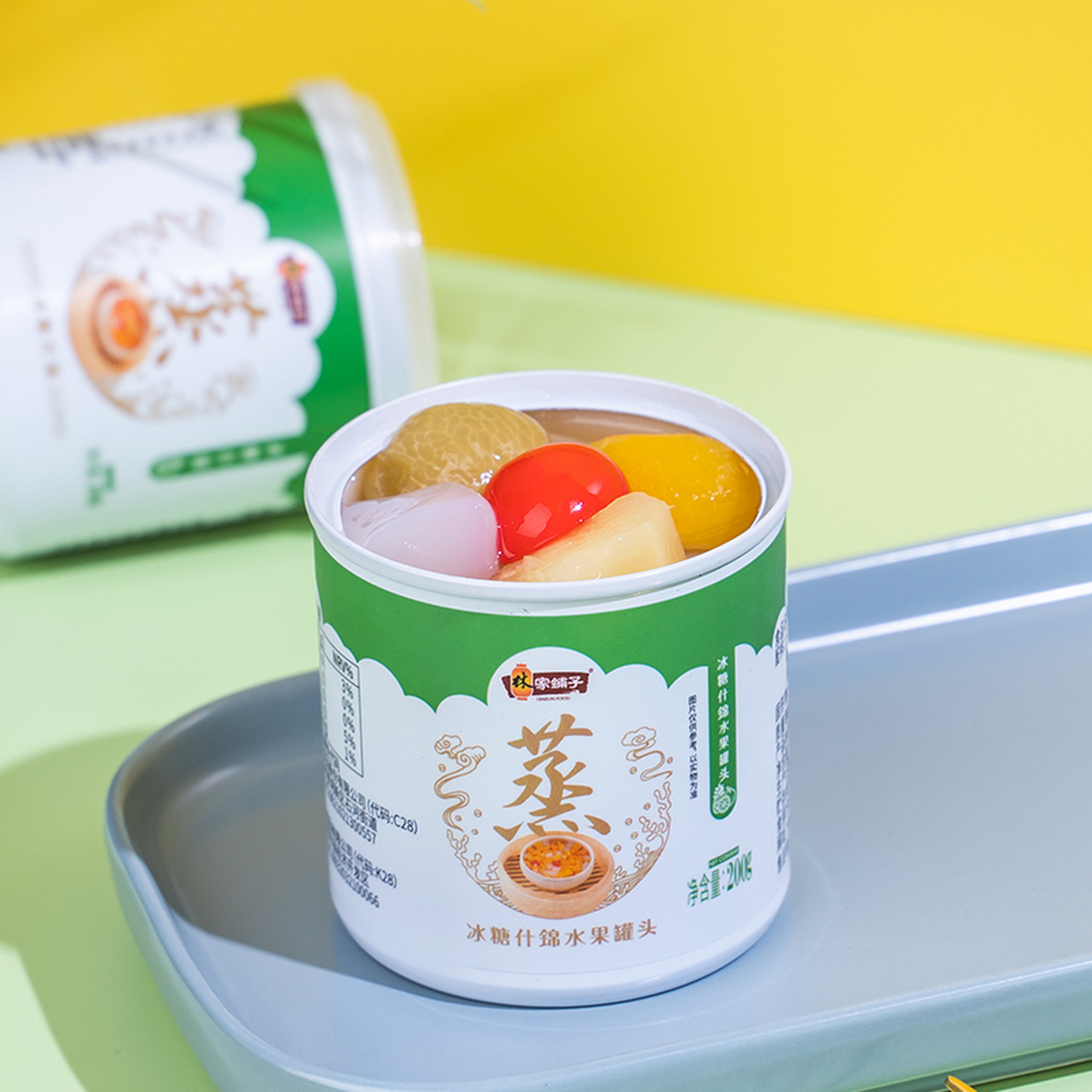 林家铺子水果罐头冰糖什锦罐头是一种混合装的水果罐头,包括黄桃和