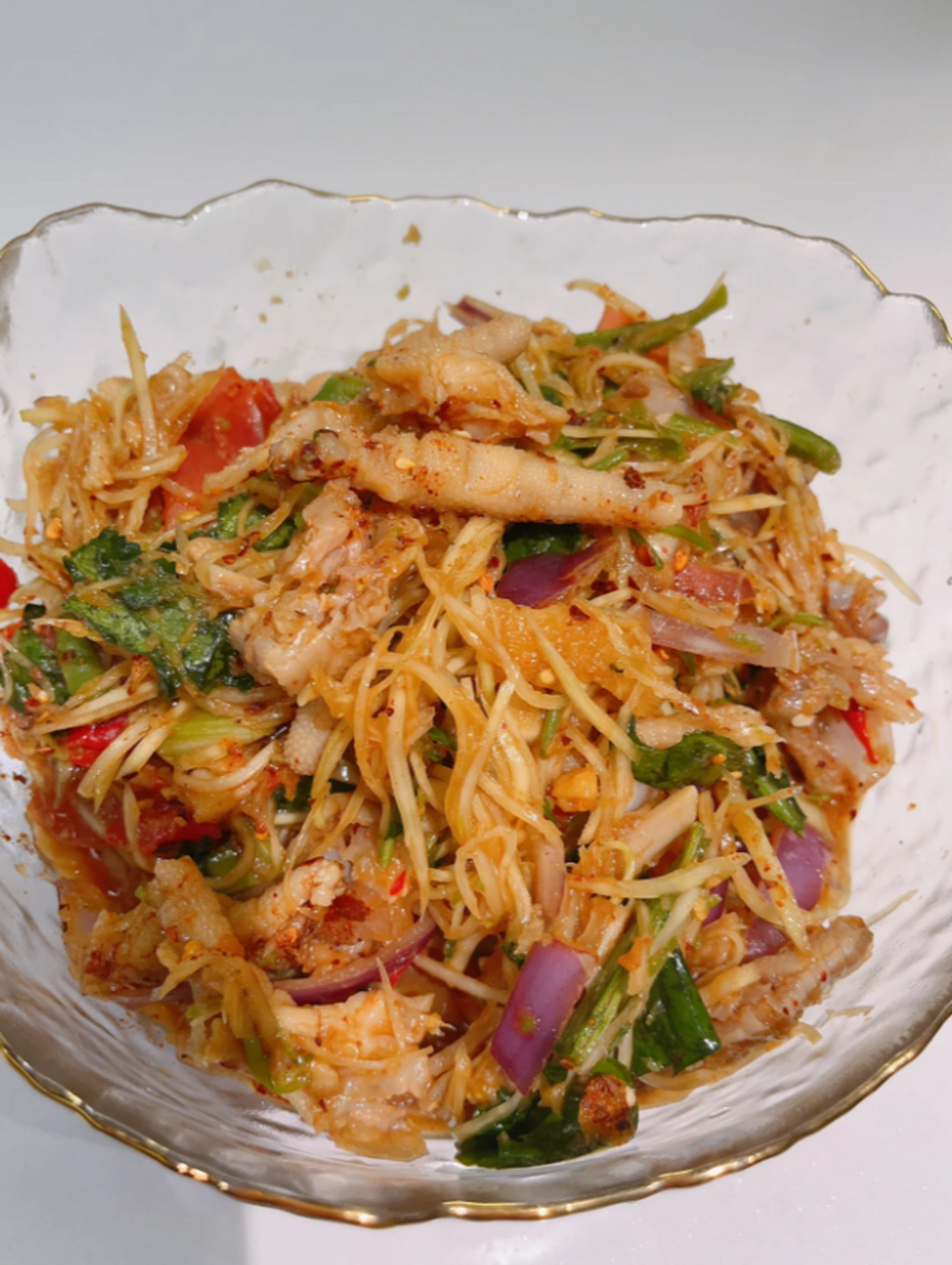 傣味柠檬舂鸡脚:酸辣过瘾,口感丰富  在西双版纳,我每天都离不开那道