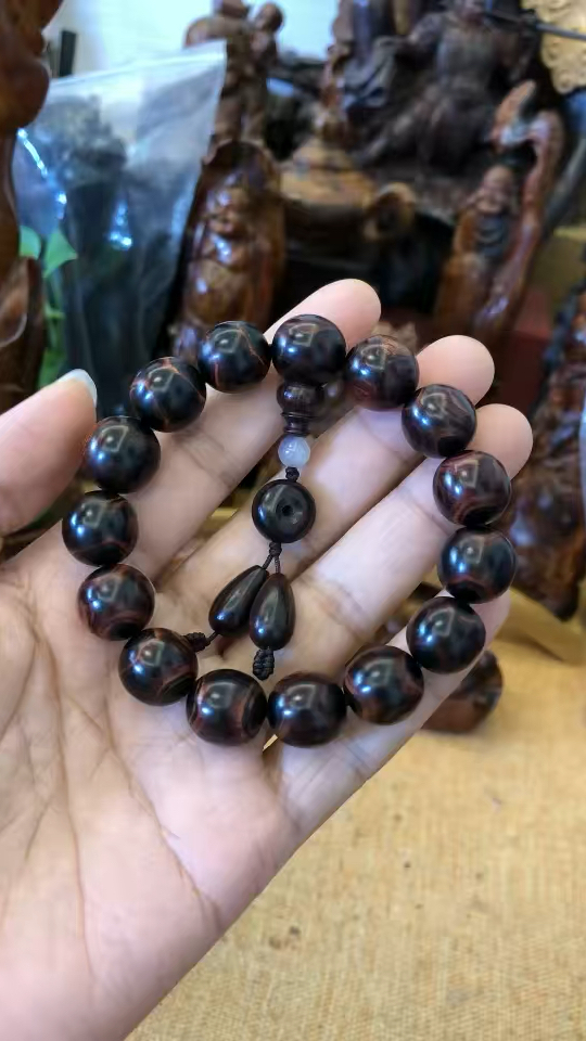 正宗海南黄花梨海南霸王岭野生紫油梨老料,1.5沉水级极品满鬼脸.