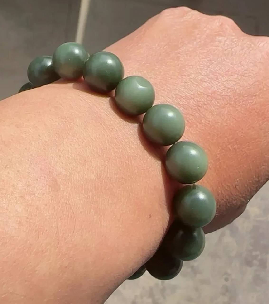 点击头像看直播##和田玉#沙枣青籽料带猫眼  圆珠手串
