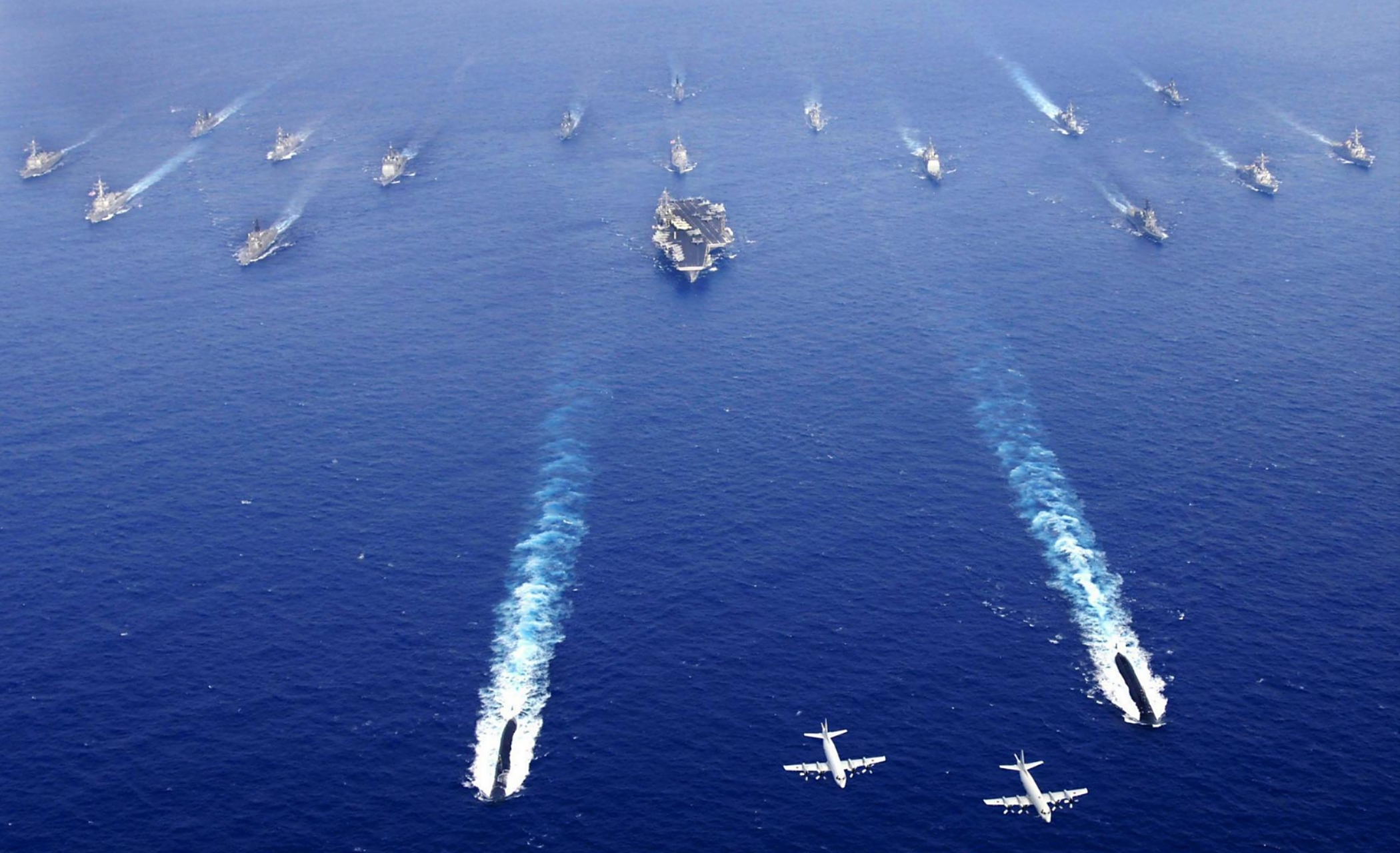 解放军演训是在美国"里根"号航母战斗群进入南海,以及台湾当局举行"