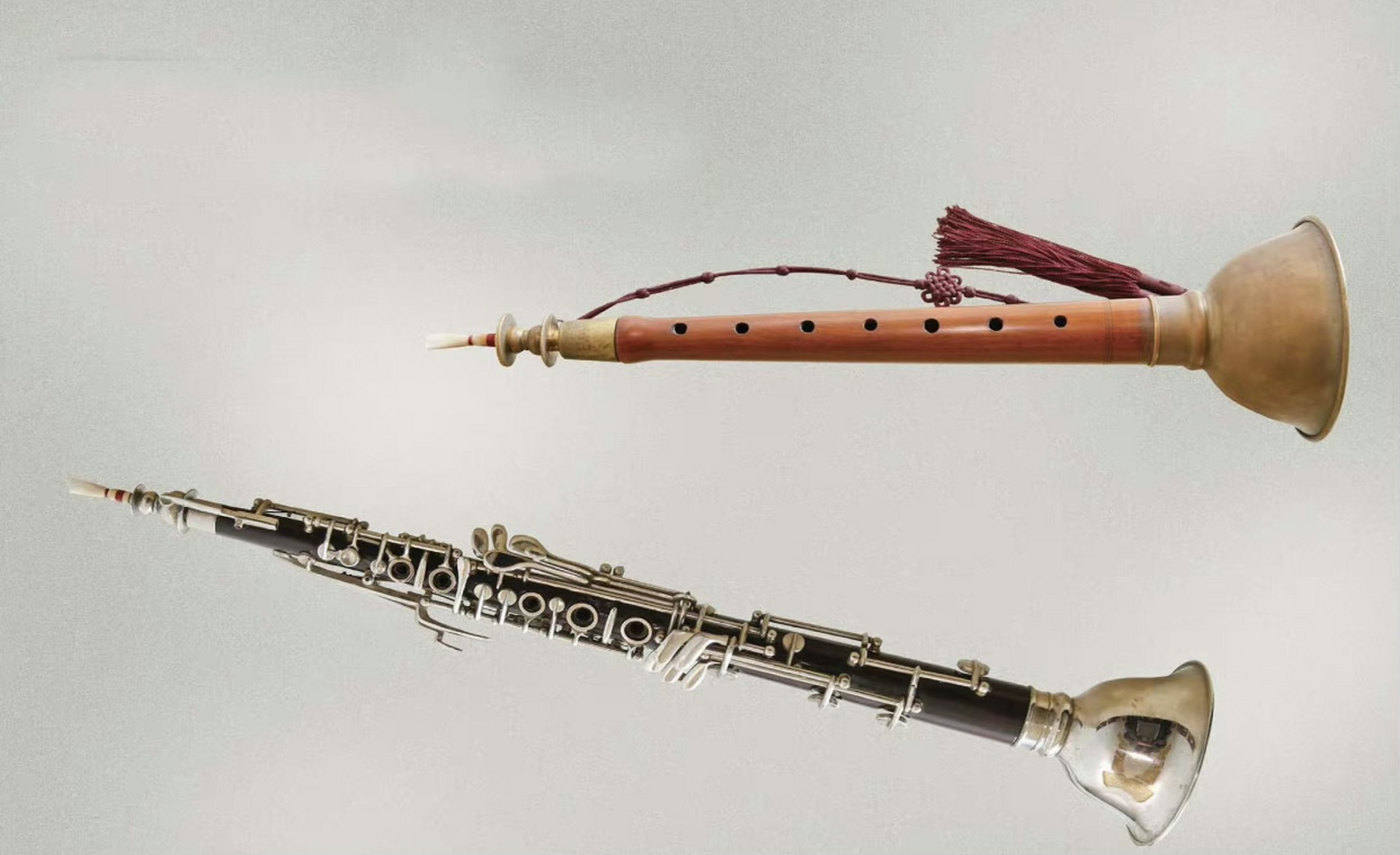 是朝鲜民族木管乐器唢呐为基础,于1960年代研制的乐器.