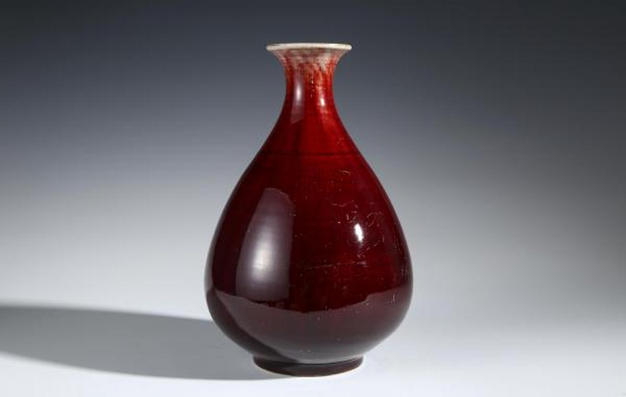 瓷器鉴赏# 此件民国解放初·红釉玉壶春瓶,口径8cm,高30.