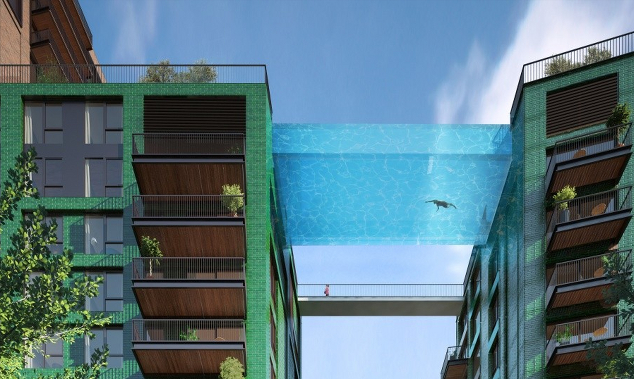 在两栋楼房建筑之间设立的透明游泳池,电影《机械师2》里的某个镜头