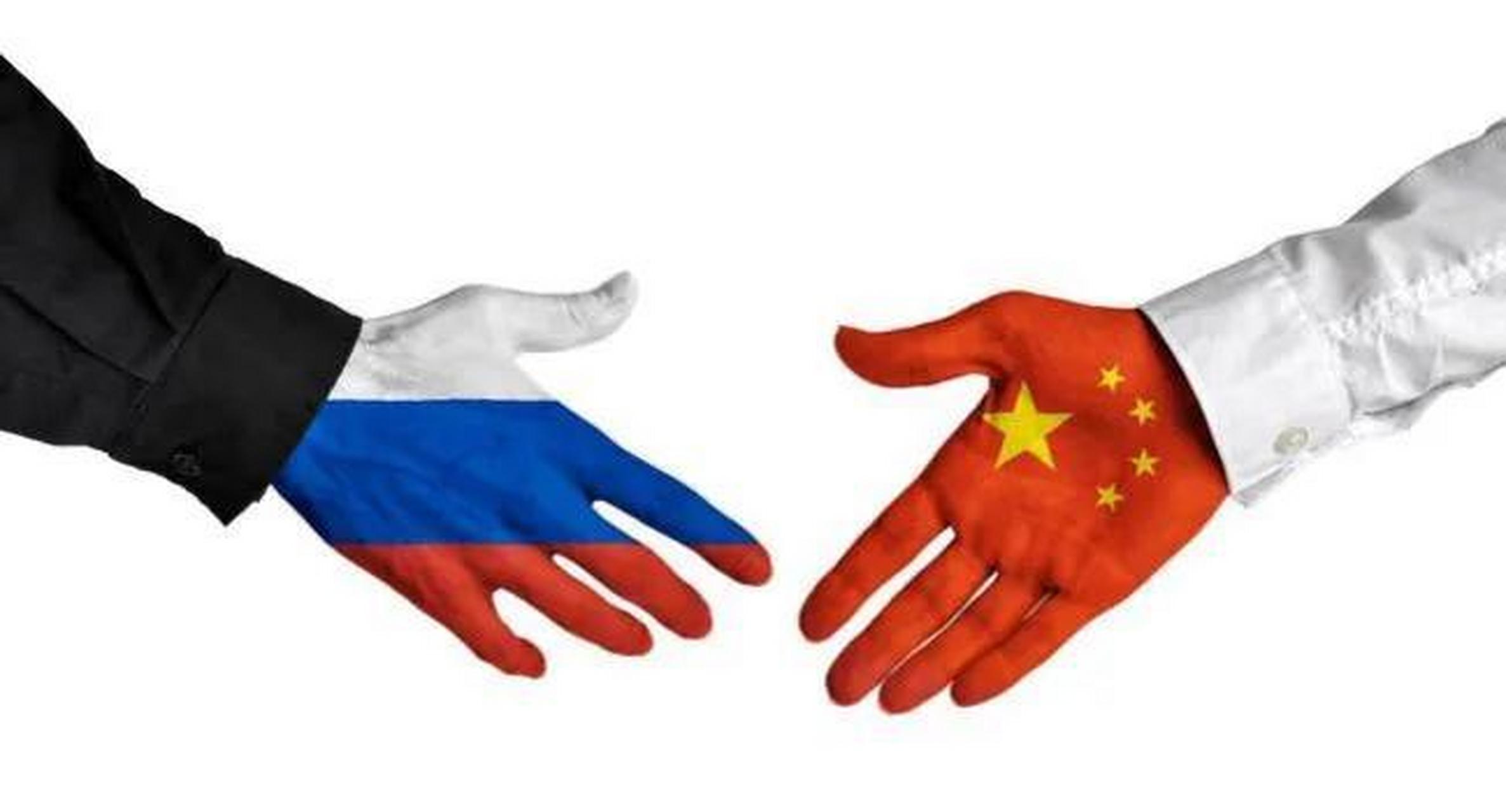 中国和俄罗斯握手图片