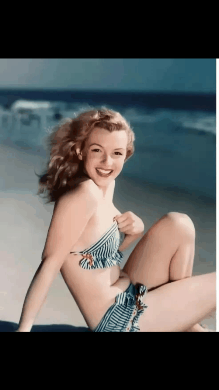 面对着镜头,玛丽莲梦露笑脸盈盈,倾国倾城,绝对是一个绝世大美人.