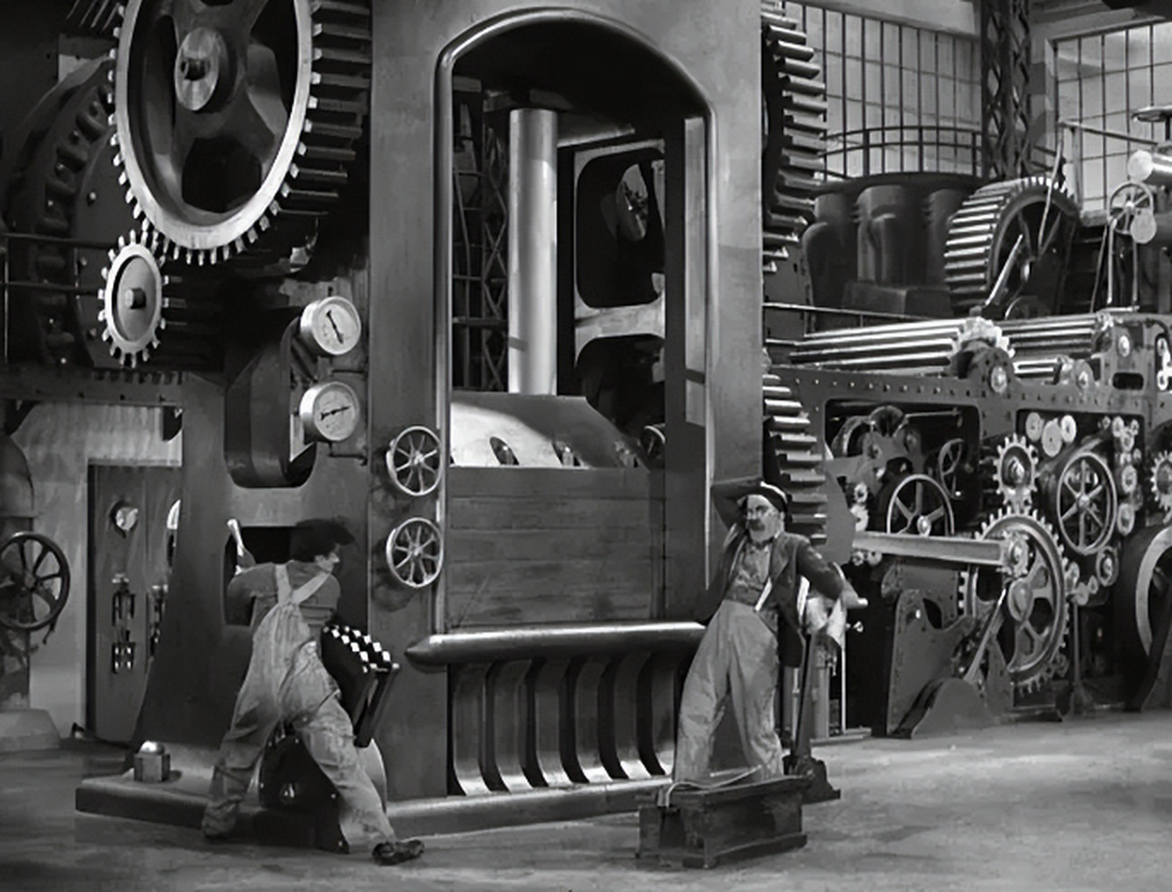 《摩登时代》:卓别林无声胜有声的现代寓言  在电影史上,查理·卓别林