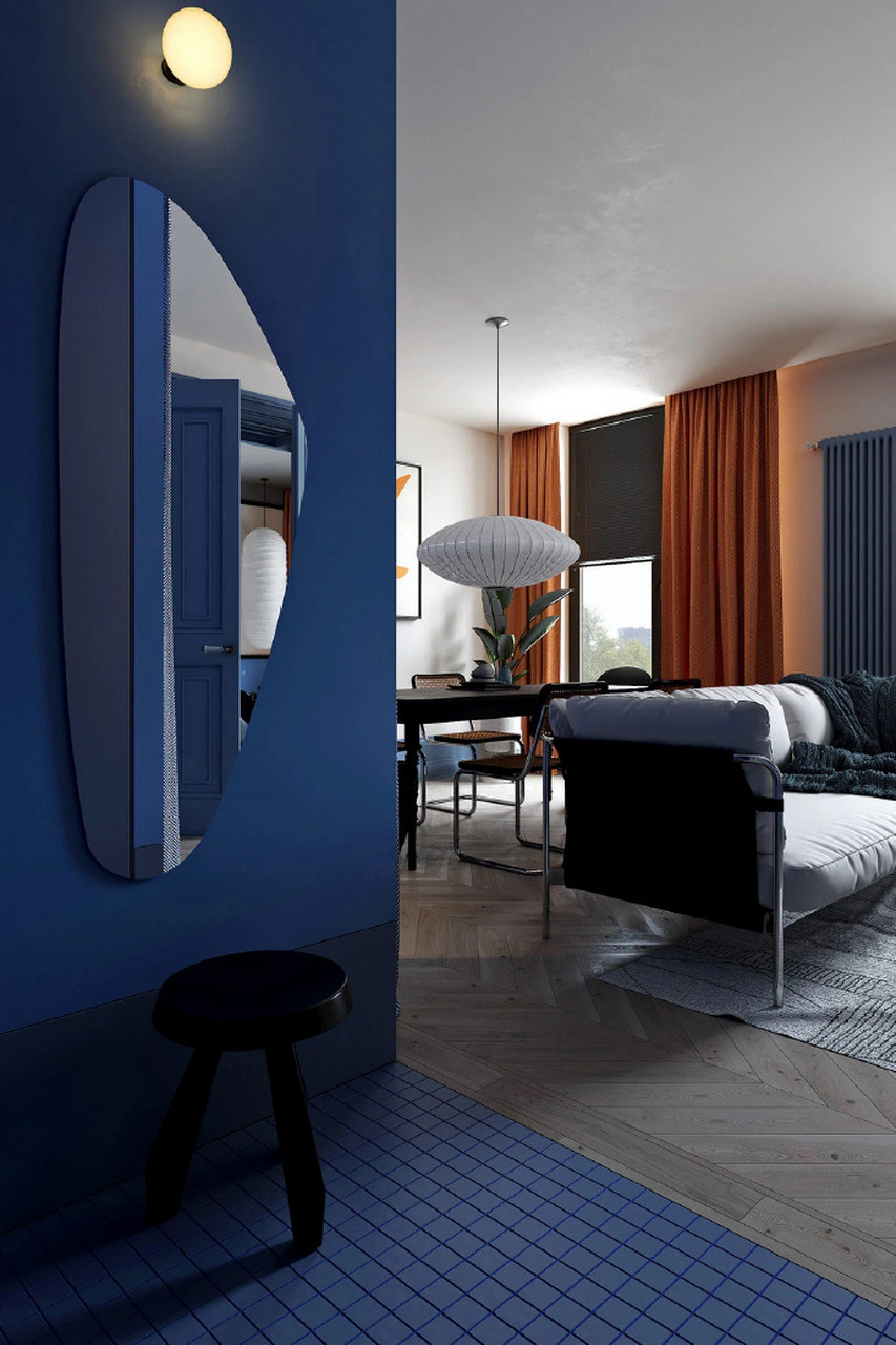 空间以白色为基底,并选择蓝色与橙色进行穿插搭配,鲜明的色彩对比让