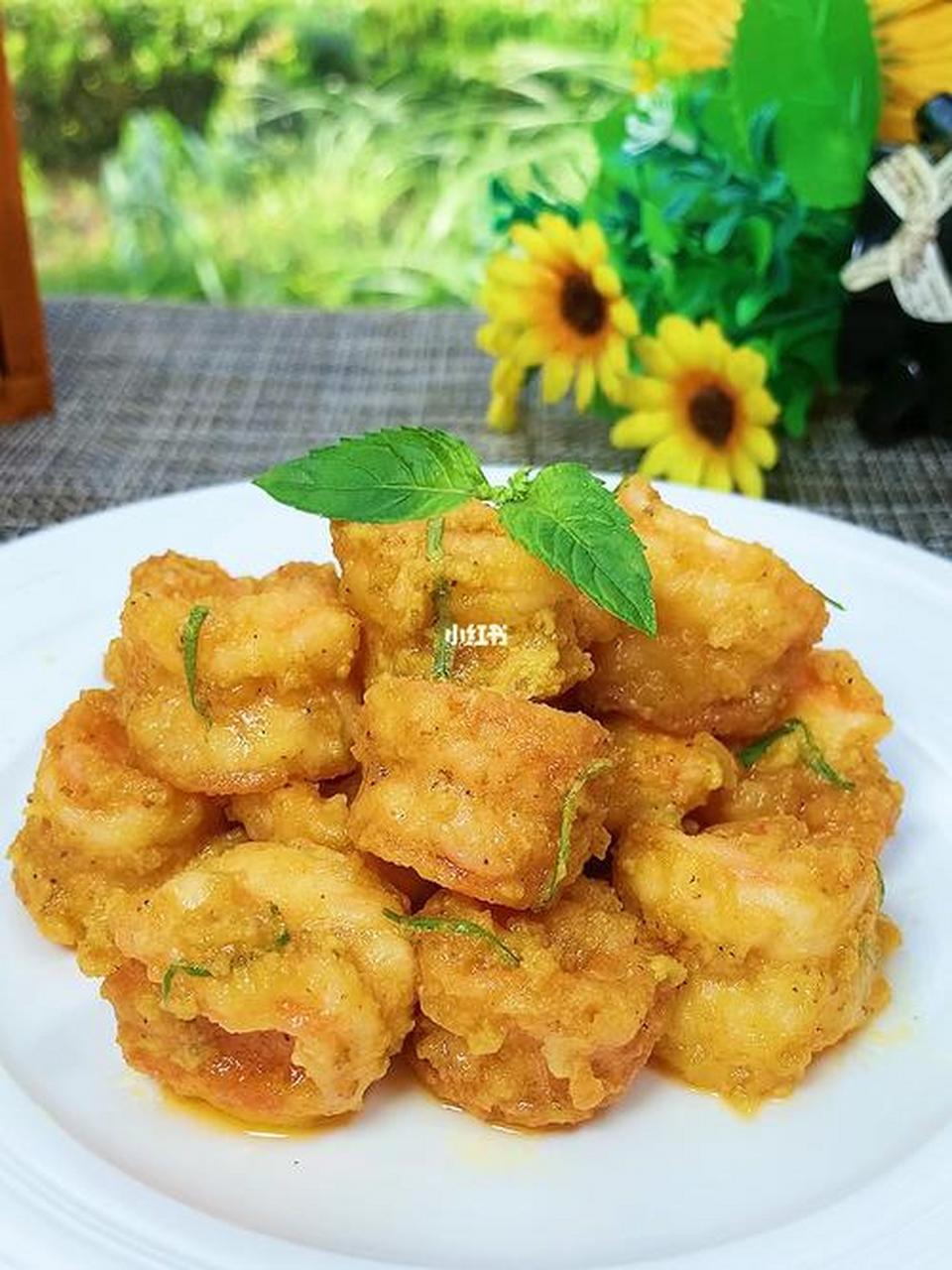 99蛋黄虾球的做法99 95蛋黄虾球是一道美味的中式菜肴,以鲜虾和