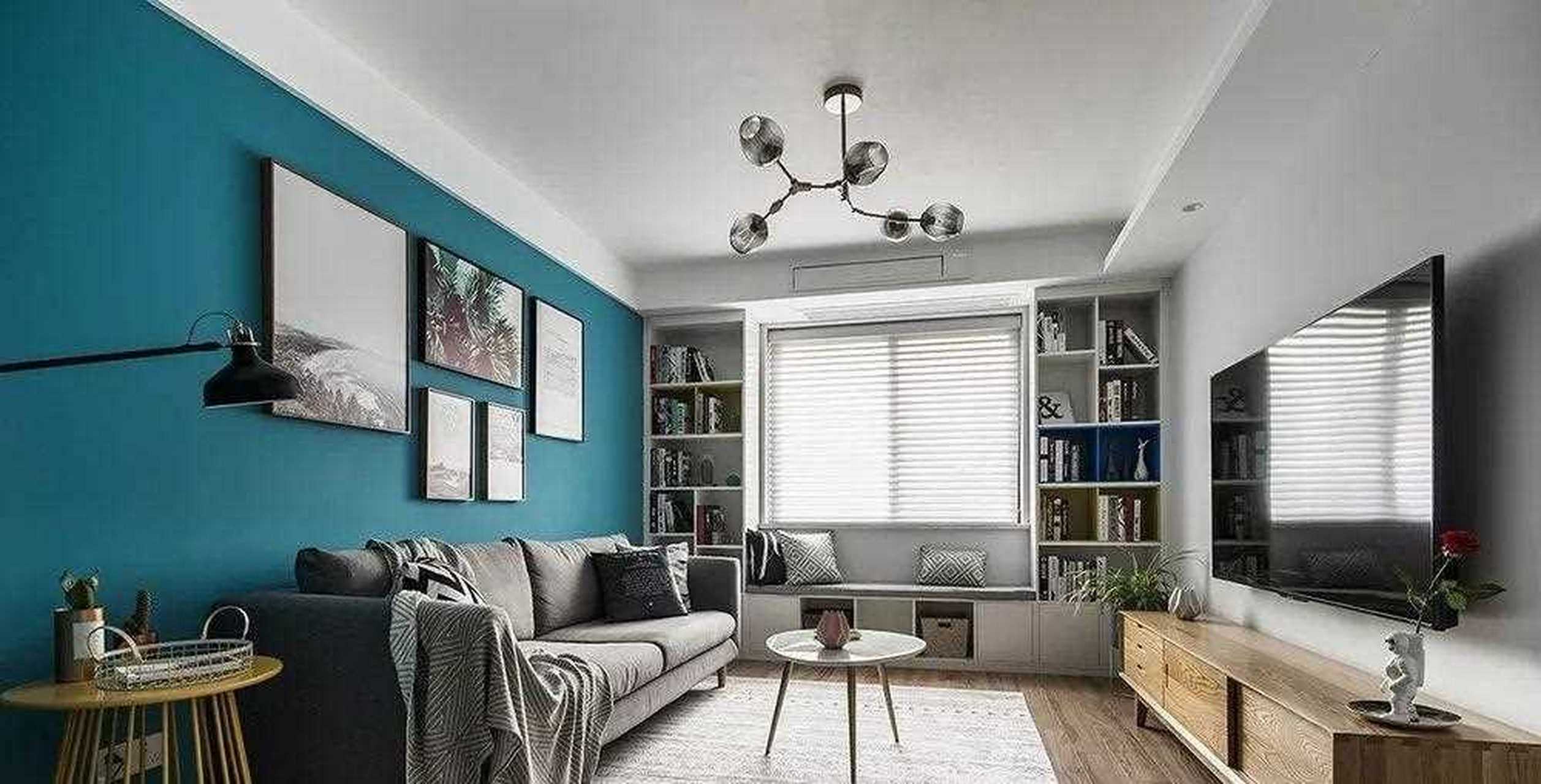 沙发背景墙采用饱和度很强的绿色,使得整个空间很有层次感.