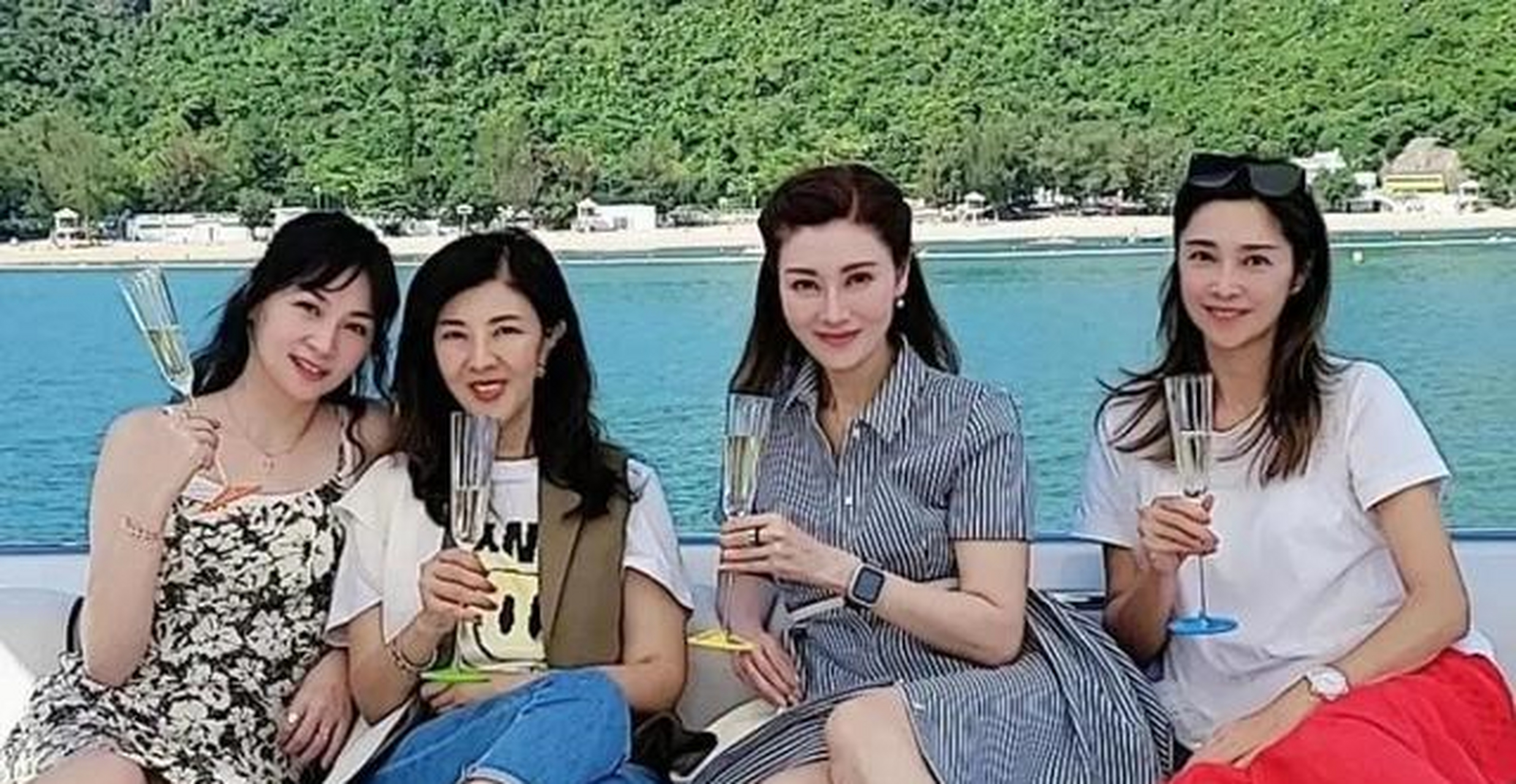 大家看一看,这张合照中的人,除了赌王千金何超琼以及俞峥外,还有