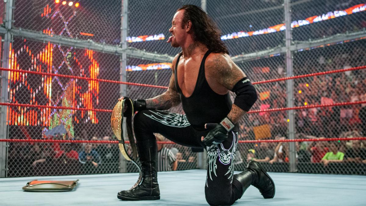 wwe送葬者夺冠高光时刻,你还记得葬爷高举大金腰带的样子吗?