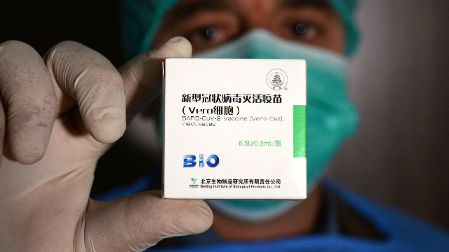 中国新冠疫苗为什么能?专访国家卫生健康委副主任曾益新