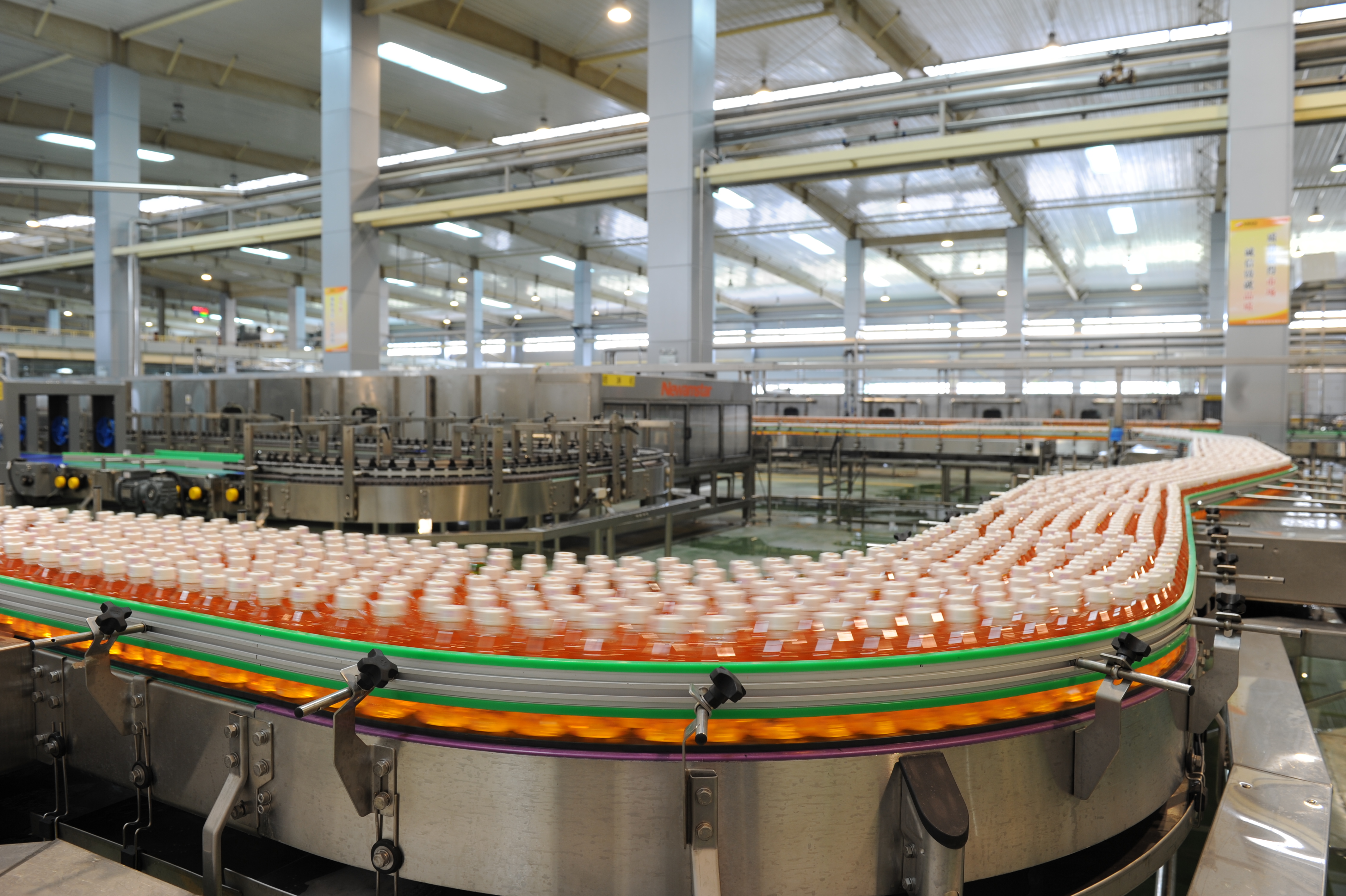 从吹灌旋一体化生产线到智能工厂,新美星与东鹏饮料共创行业奇迹