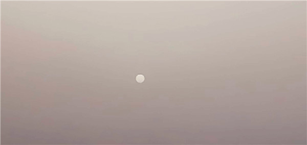 奇!扬沙天儿现"白太阳"