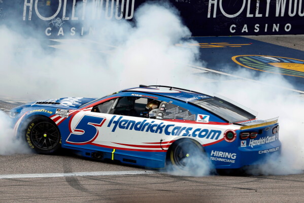 1 of 4 | Kyle Larson does a burnout after winning a NASCAR Cup Series auto race in Kansas City, Kan., Sunday, Sept. 27, 2026. (AP Photo/Colin E. Braley) License this photo