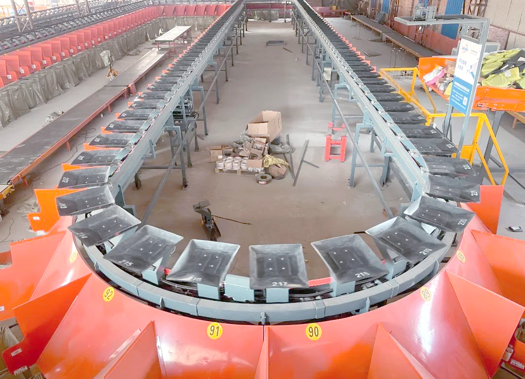 为何环形翻板分拣机在自动化分拣设备中备受青睐?