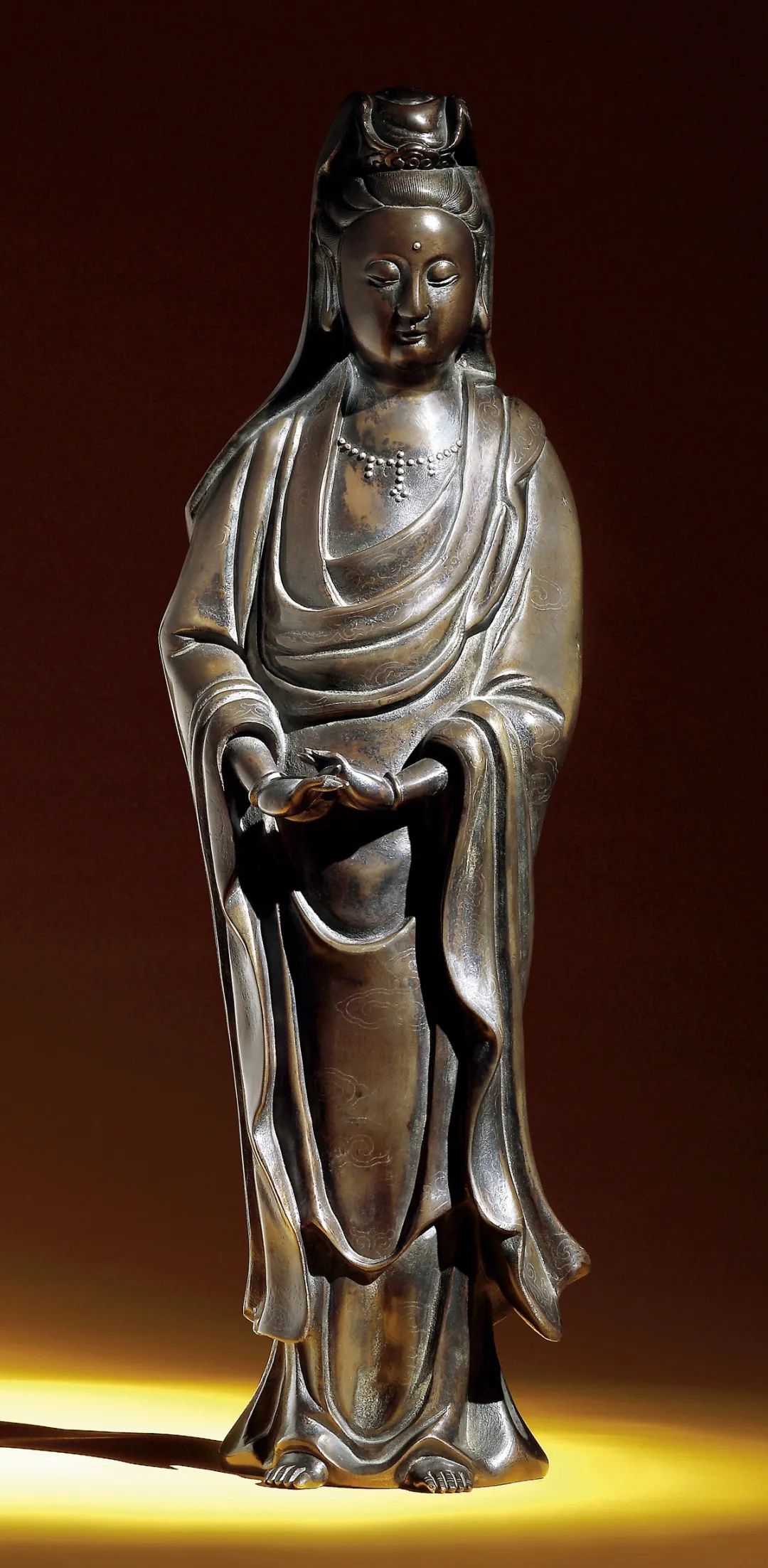 "石叟"款铜嵌银丝观音立像