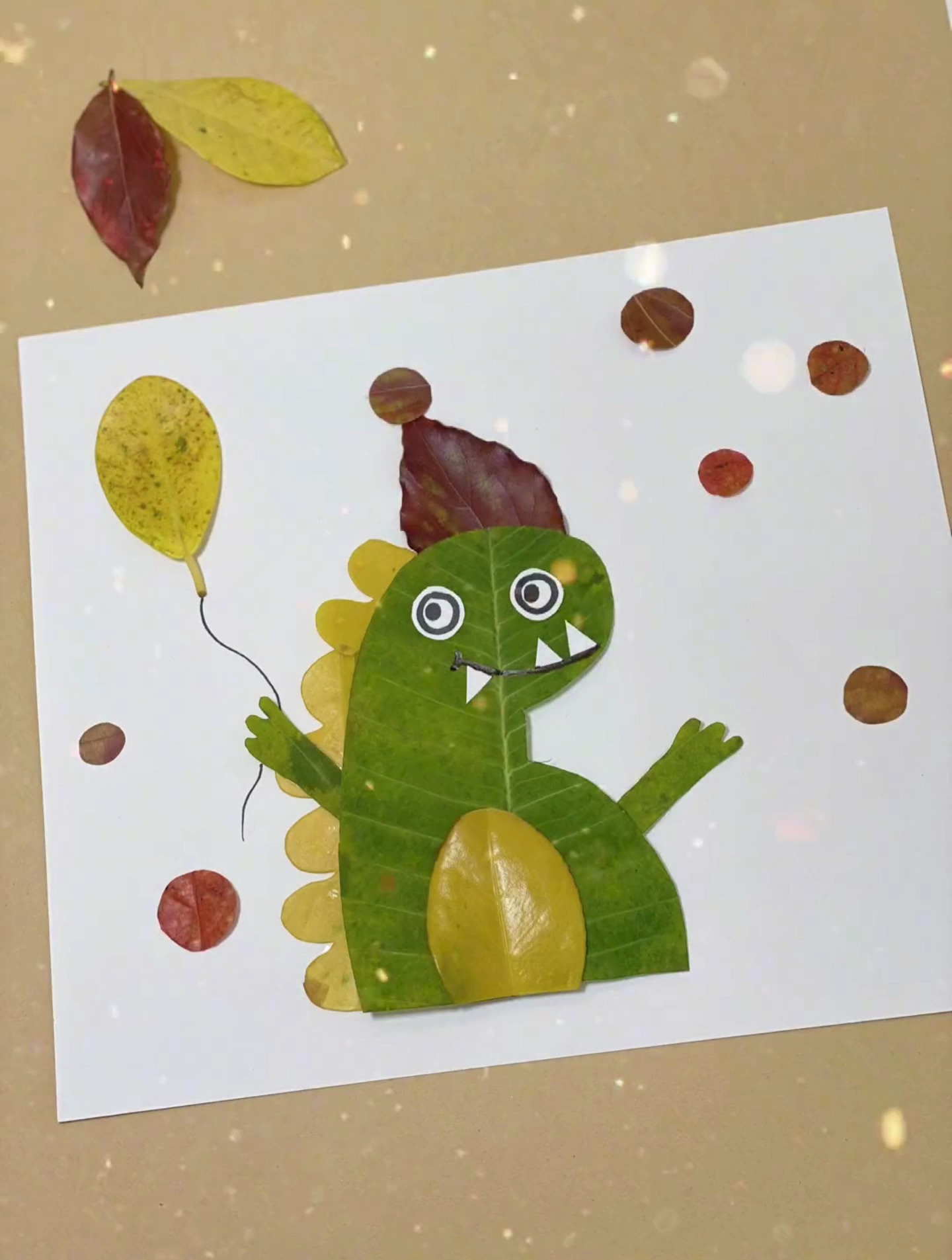 过生日的小恐龙树叶贴画来啦