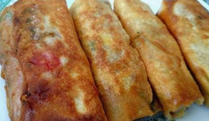 的菜,加上皮的酥脆口感,更具津味儿,早晨坐在早点铺里吃上一个卷圈儿