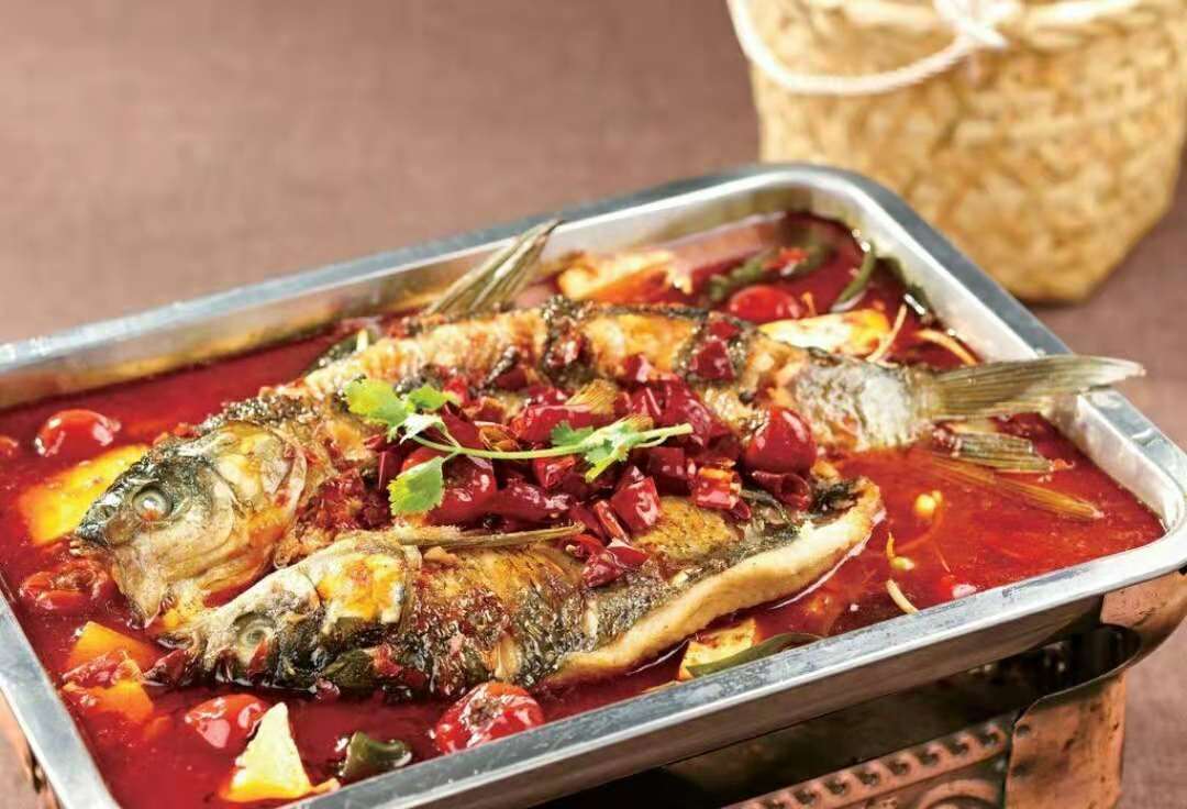巫山烤鱼,以它独有的配料和做法闻名与北方