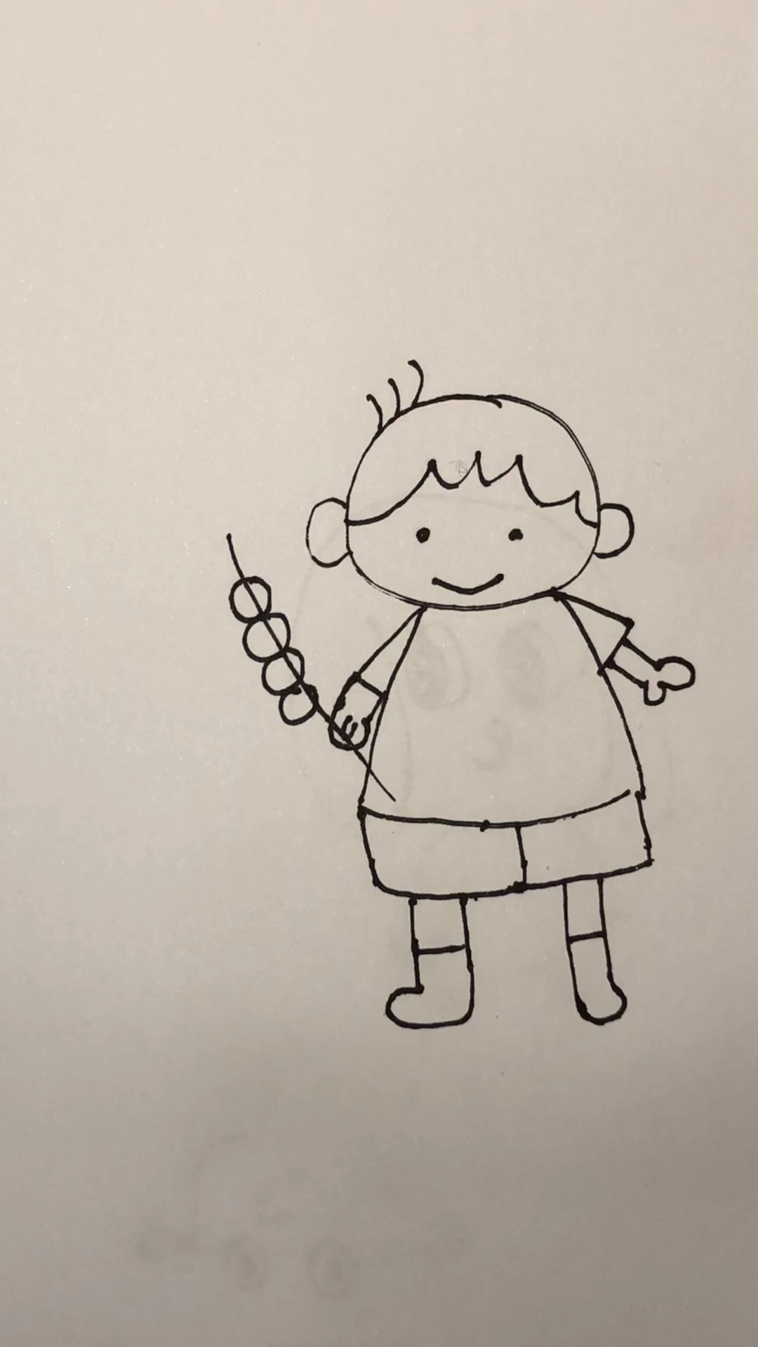 小孩吃糖葫芦的简笔画图片