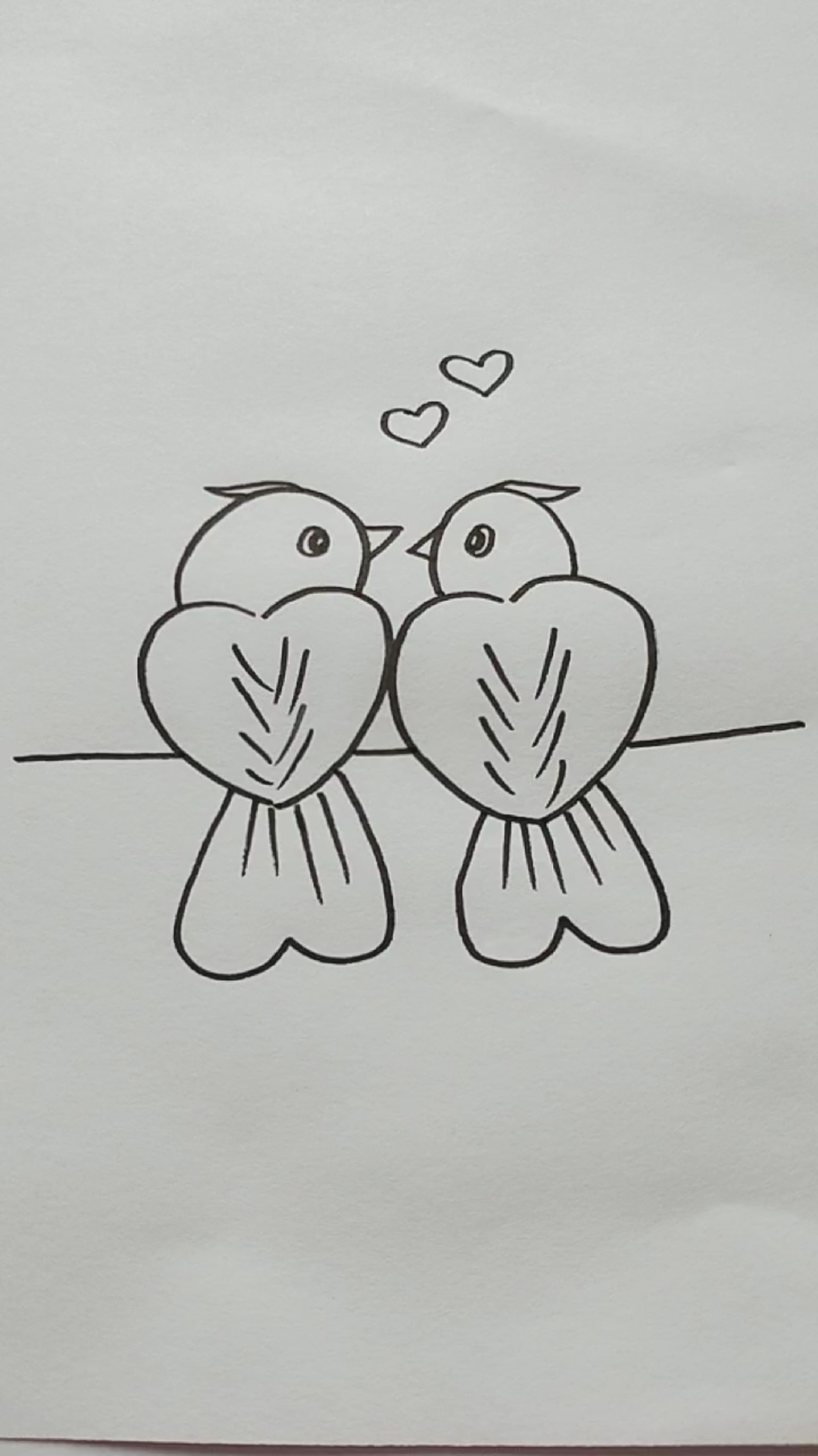 用两个爱心画两只小鸟